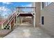 Backyard patio with wooden deck and stairs, offering a spacious outdoor entertainment area at 513 Mirramont Pl, Woodstock, GA 30189