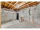 Unfinished basement with concrete walls and exposed pipes, perfect for creating a personalized space at 513 Mirramont Pl, Woodstock, GA 30189