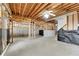 Unfinished basement with visible framing and concrete walls, offering potential for customization at 513 Mirramont Pl, Woodstock, GA 30189
