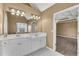 Bathroom with double vanity sinks, ample counter space, and recessed lighting at 513 Mirramont Pl, Woodstock, GA 30189