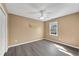 Bedroom with hardwood floors, natural light, and a ceiling fan at 513 Mirramont Pl, Woodstock, GA 30189