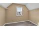 Cozy walk-in closet featuring hardwood floors, natural light, and metal shelving at 513 Mirramont Pl, Woodstock, GA 30189