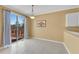 Bright dining area with sliding door access to the outdoor deck and neutral tile flooring throughout at 513 Mirramont Pl, Woodstock, GA 30189