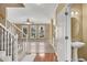 Entryway featuring hardwood floors, staircase with a decorative railing, and an updated sink at 513 Mirramont Pl, Woodstock, GA 30189