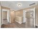 Upstairs hallway showing vinyl flooring and access to bedrooms and bathroom at 513 Mirramont Pl, Woodstock, GA 30189