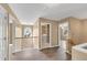 Upstairs landing with neutral walls and vinyl flooring leads to various rooms including the laundry at 513 Mirramont Pl, Woodstock, GA 30189