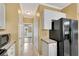 A convenient kitchen layout with essential appliances and hallway access at 513 Mirramont Pl, Woodstock, GA 30189