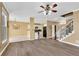 Open-concept living space showcasing hardwood floors, a staircase, and a view of the kitchen at 513 Mirramont Pl, Woodstock, GA 30189