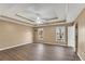 Spacious main bedroom features natural light, tray ceiling, and modern flooring at 513 Mirramont Pl, Woodstock, GA 30189