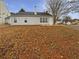 A view of the backyard featuring a modest, grassy lawn and a home's exterior at 2328 Wavetree Nw Ln, Acworth, GA 30101