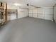 Spacious garage with a painted floor and mechanicals visible at 2328 Wavetree Nw Ln, Acworth, GA 30101