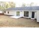 A view of the backyard shows a patio area and access to the house with a white exterior at 5928 Seam St, Lithonia, GA 30058