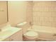 Bathroom features tiled bathtub and shower area with sink and mirror at 5928 Seam St, Lithonia, GA 30058