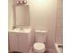 Bathroom features a white vanity with a mirror and a toilet at 5928 Seam St, Lithonia, GA 30058