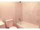 Bathroom featuring tiled bathtub and shower area at 5928 Seam St, Lithonia, GA 30058