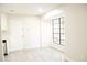 Bright dining area with a large window and light gray flooring at 5928 Seam St, Lithonia, GA 30058