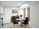 Dining area with modern lighting, table setting, and a window at 5928 Seam St, Lithonia, GA 30058