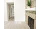 Hallway with light-colored flooring and a stone fireplace view at 5928 Seam St, Lithonia, GA 30058