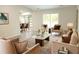 Cozy living room with neutral-toned furniture and ample natural light at 5928 Seam St, Lithonia, GA 30058