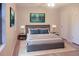 Bedroom featuring a gray bed, matching lamps, and two bedside tables at 5928 Seam St, Lithonia, GA 30058