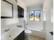 Bathroom featuring a combination shower and tub, toilet and sink at 901 Chapman Cir, Stone Mountain, GA 30088