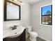 Bathroom featuring a large vanity, mirror and toilet at 901 Chapman Cir, Stone Mountain, GA 30088