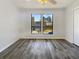 A spacious bedroom with natural light and vinyl flooring at 901 Chapman Cir, Stone Mountain, GA 30088