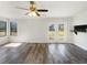 Living room featuring glass patio doors and hardwood flooring at 901 Chapman Cir, Stone Mountain, GA 30088