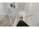 Bright stairwell with white bannister and wood floors on landing at 901 Chapman Cir, Stone Mountain, GA 30088