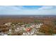 Aerial view of neighborhood surrounded by foliage and trees in fall at 12 Ridgeline Nw Way, Cartersville, GA 30121