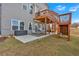 A large back yard with patio and stairs to a deck above at 12 Ridgeline Nw Way, Cartersville, GA 30121
