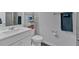 Well-lit bathroom featuring a white vanity, toilet, and towel rack at 12 Ridgeline Nw Way, Cartersville, GA 30121