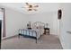 Cozy bedroom featuring a black metal bed frame and neutral walls with natural light from window at 12 Ridgeline Nw Way, Cartersville, GA 30121