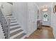 Bright entryway with hardwood floors, staircase, and decorative accents at 12 Ridgeline Nw Way, Cartersville, GA 30121