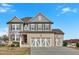 Charming two-story home with a brick and gray exterior, complemented by a spacious three-car garage at 12 Ridgeline Nw Way, Cartersville, GA 30121