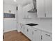 Stylish kitchen with white cabinetry, granite countertops, and modern appliances at 12 Ridgeline Nw Way, Cartersville, GA 30121
