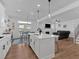 Open concept kitchen with stainless steel appliances, a center island, and an adjacent living space at 12 Ridgeline Nw Way, Cartersville, GA 30121