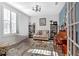 Sunlit living room with hardwood floors, a piano, and cozy seating at 12 Ridgeline Nw Way, Cartersville, GA 30121