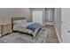 Comfortable bedroom with a bed, rug, and window bench with storage at 12 Ridgeline Nw Way, Cartersville, GA 30121