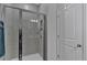Modern tiled shower with glass door and built in shelf at 12 Ridgeline Nw Way, Cartersville, GA 30121