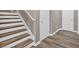 Staircase featuring wood treads, white risers, and gray walls at 12 Ridgeline Nw Way, Cartersville, GA 30121
