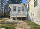 A rear deck and patio offer outdoor enjoyment with a view of the surrounding yard at 140 Thrasher Rd, Covington, GA 30016