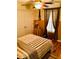 Bedroom featuring hardwood floors, ceiling fan, and decorative window drapes at 140 Thrasher Rd, Covington, GA 30016