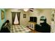 Comfortable bedroom with ceiling fan, dresser, and tv at 140 Thrasher Rd, Covington, GA 30016