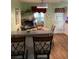 Eat-in kitchen with a round table, four chairs, and breakfast bar with barstools at 140 Thrasher Rd, Covington, GA 30016