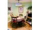 Eat-in kitchen with a round table, 4 chairs, and laminate flooring at 140 Thrasher Rd, Covington, GA 30016