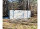 Exterior view of a storage container located on a wooded lot at 140 Thrasher Rd, Covington, GA 30016