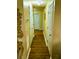 Hallway with laminate flooring, neutral walls, white doors and a decorative table at 140 Thrasher Rd, Covington, GA 30016