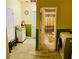 Functional laundry area with washer, storage, and easy access to an adjacent bathroom at 140 Thrasher Rd, Covington, GA 30016