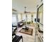 Bright sunroom with many windows, ceiling fan, neutral walls and flooring, and patio furniture at 140 Thrasher Rd, Covington, GA 30016